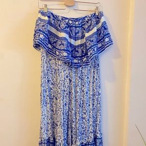 Beautiful blue and white crop top romper with flare leg bottoms.